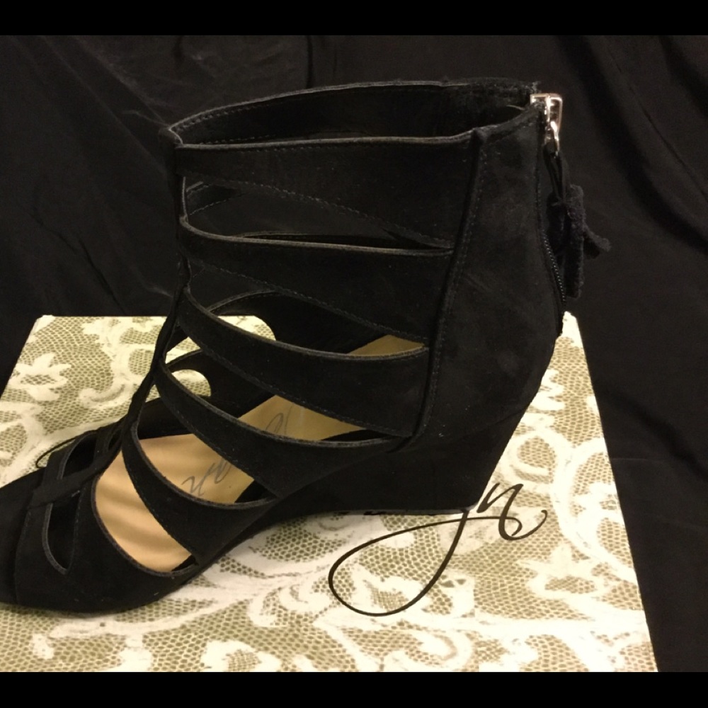 Brand new black suede wedges with zipper. Size 10.